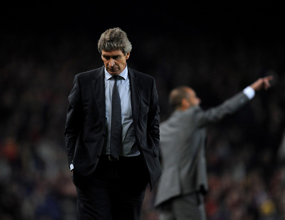 Coach Manuel Pellegrini of Real Madrid looks dejected during the La Liga match between Barcelona and Real Madrid at the Camp Nou Stadium on November 29, 2009 in Barcelona, Spain. Barcelona won the match 1-0.