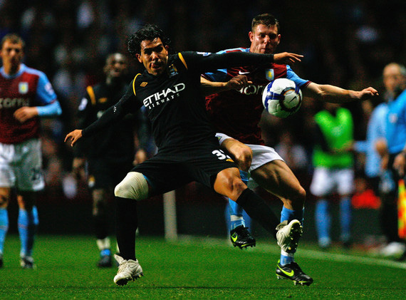 Carlos Tevez of Manchester City competes for the ball with James Milner of Aston Villa during the Barclays Premier League match between Aston Villa and Manchester City at Villa Park on October 5, 2009 in Birmingham, England. (October 4, 2009 - Photo by Clive Rose/Getty Images Europe) 